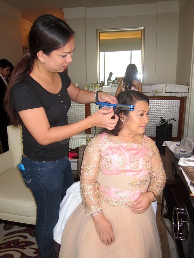 Wheng smoothing out some baby hairs. hehe